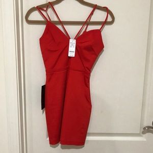 Brand new Bebe mini dress in red